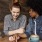 lifestyle image of a couple holding hands over coffee