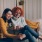 lifestyle image of two women on a couch